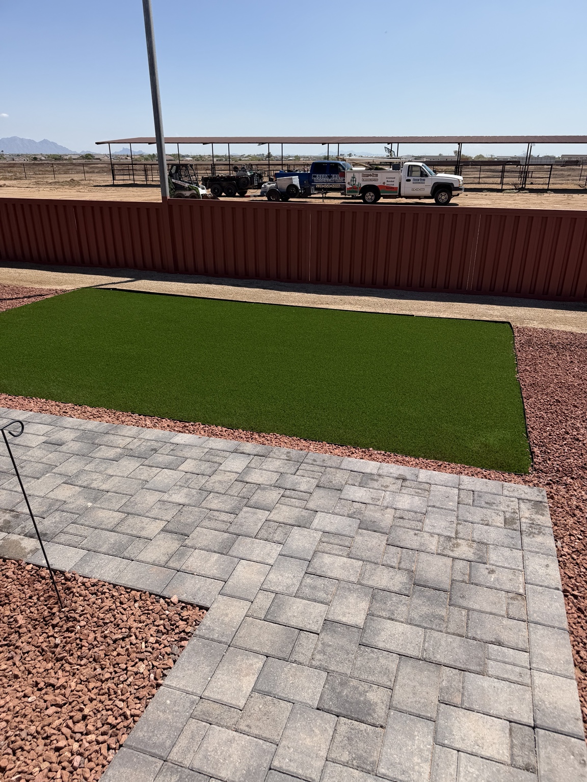 Artificial turf, paver walkway, and decorative granite installation